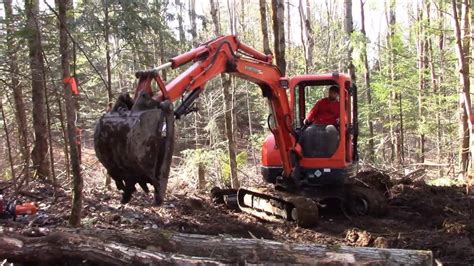 clearing trees with mini excavator|land clearing with mini excavator.